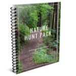 This is a spiral bond book. On the cover is a trail lined with trees. The title is, "Nature Hunt Pack; Teaching with Faith."