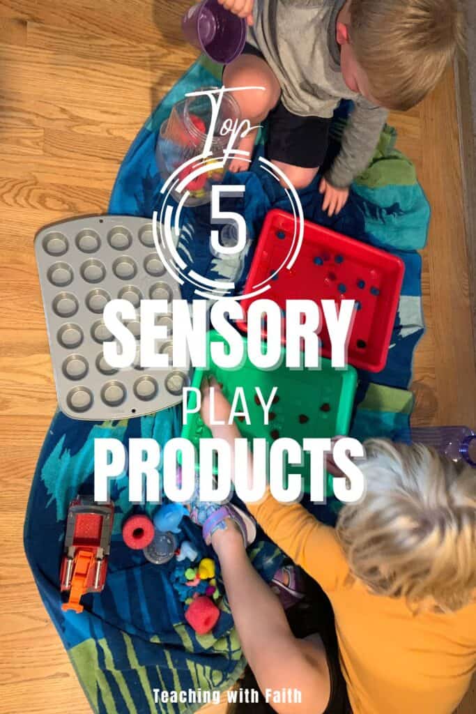 Pinable image featuring two young children sitting on a colorful blanket engaging in sensory play with various sensory bin products, including muffin tins, plastic trays, pom-poms, and scoops. Overlay text reads “Top 5 Sensory Play Products” with the blog name “Teaching with Faith,” making it ideal for a Pinterest pin promoting preschool sensory ideas.